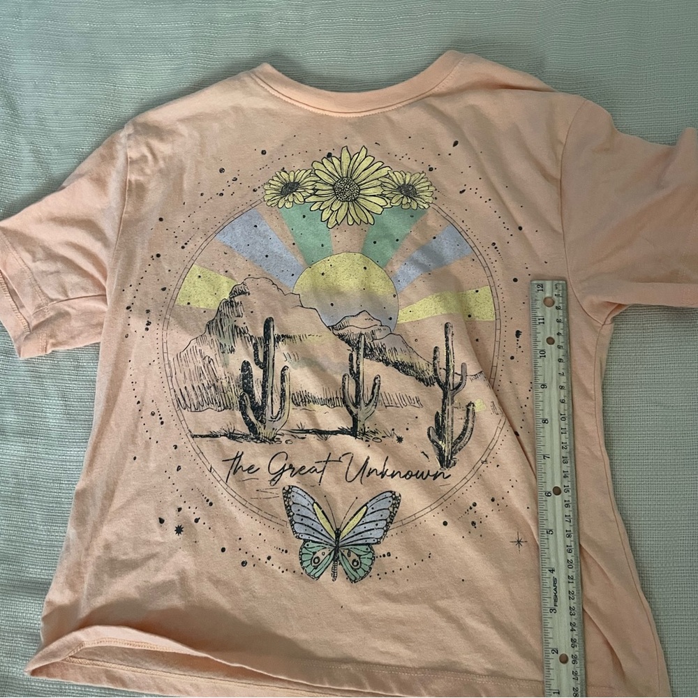Graphic tee by love tribe! Size XS in women’s. Good condition!